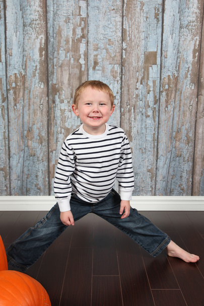 Cute little boy with pumpkins - Foto, imagen