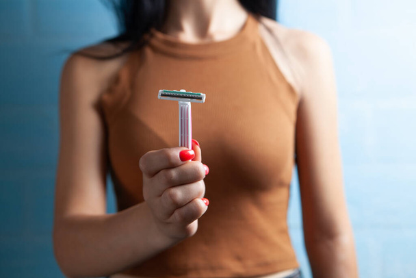 young woman holding a razor - Photo, Image