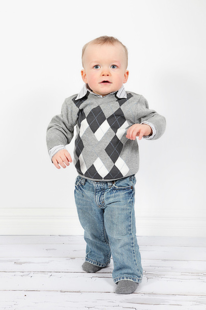 Little boy in pullover and jeans - Фото, изображение