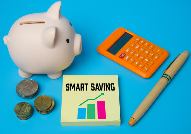 A picture of smart saving word and graph with other prop insight. Smart saving plan and investment concept. - Photo, Image