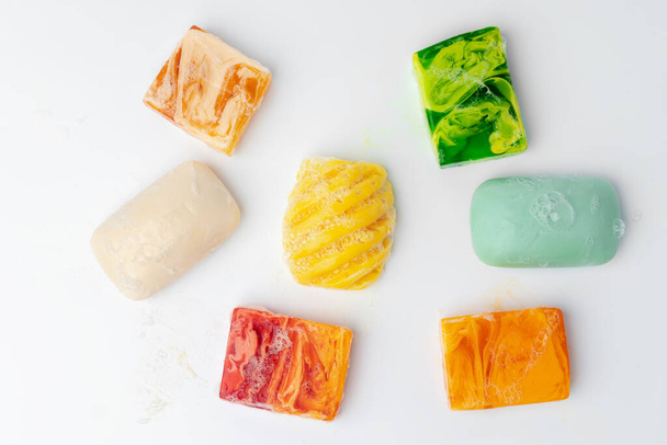 Colorful handmade soap bars on a white background - Фото, изображение