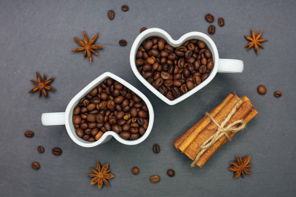 Roasted Coffee beans in heart shape cups. - Фото, изображение
