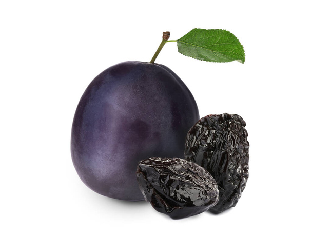 Delicious fresh ripe plum and sweet dried prunes on white background  - Foto, Imagem