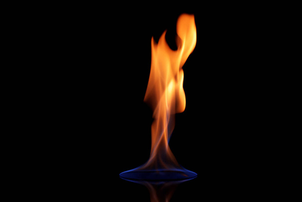 Beautiful view of flaming vodka on black background - Fotó, kép