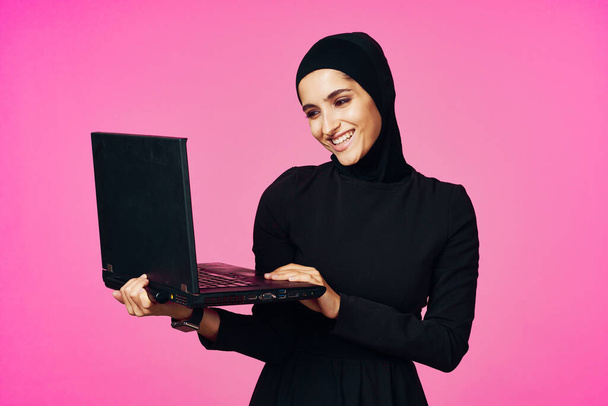 cheerful muslim woman with laptop education student internet technology - Foto, imagen