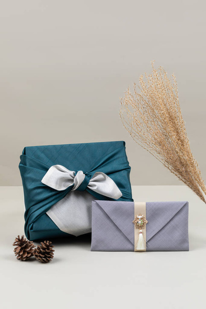 Korean holiday gift concept, gift box wrapped in silk cloth, money envelope in Hanji - 写真・画像