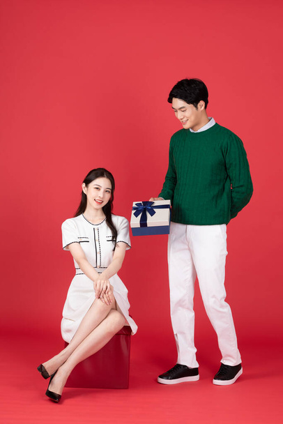 Asian Korean couple in winter fashion, Christmas shopping event concept - Φωτογραφία, εικόνα