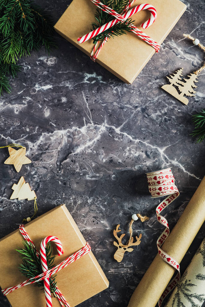Christmas gifts and decorations on stone table background. Flat lay, top view, copy space. - Zdjęcie, obraz