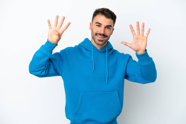 Young caucasian man isolated on white background counting nine with fingers - Photo, Image