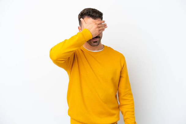 Young caucasian man isolated on white background covering eyes by hands. Do not want to see something - Photo, Image
