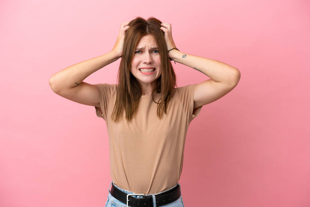 Young English woman isolated on pink background doing nervous gesture - Foto, Imagem