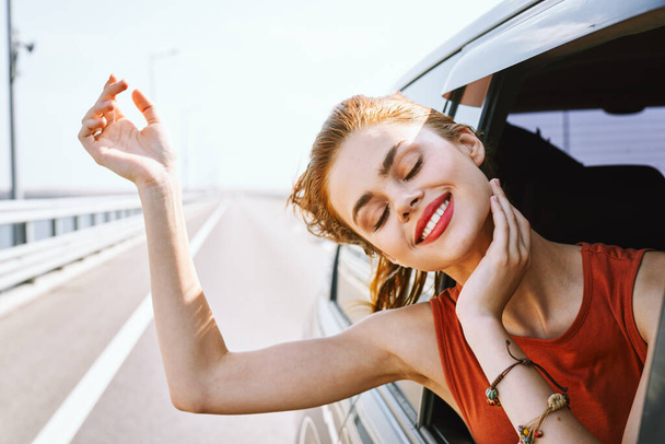 cheerful woman car ride road travel adventure - Foto, Imagem