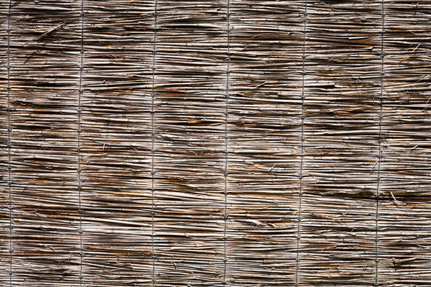 Abstract background. Straw fence. Background from natural materials. - Valokuva, kuva