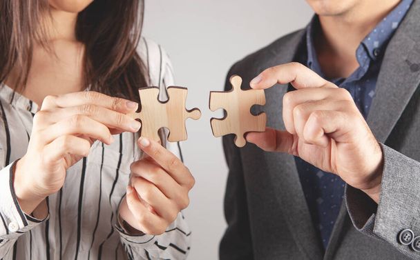 business partners holding puzzle pieces - Фото, зображення
