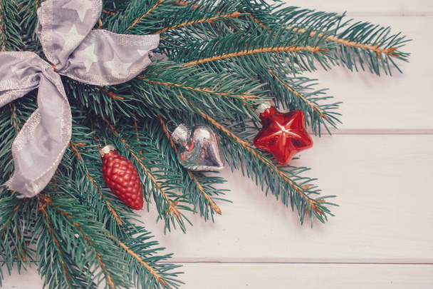 Spruce branch on a white background. Christmas background. - Fotó, kép