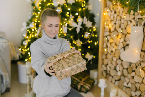 Woman's hands holding christmas gift presents. Selective focus - Foto, Imagem