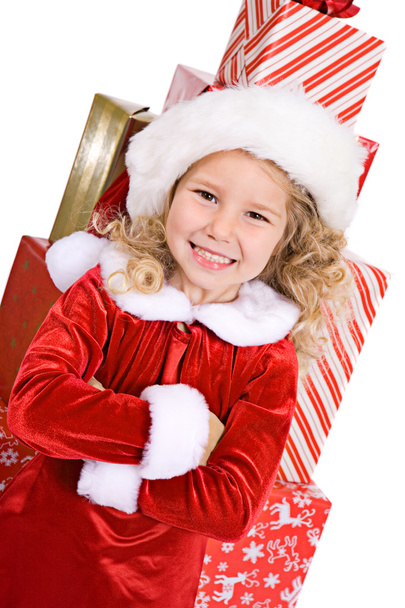 Christmas: Little Girl In Front Of Large Stack Of Wrapped Gifts - Zdjęcie, obraz