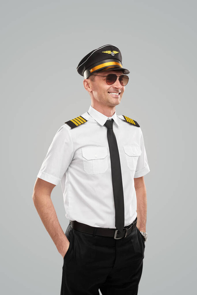 Cheerful man in pilot uniform - Fotografie, Obrázek