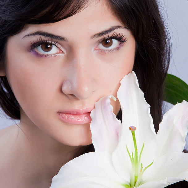 Beautiful woman with lily - Photo, image