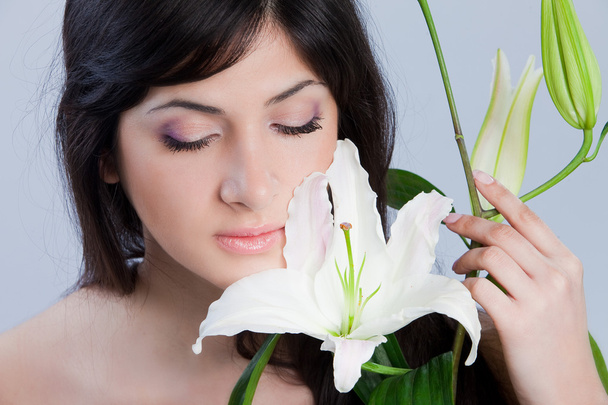 Beautiful woman with lily - Zdjęcie, obraz