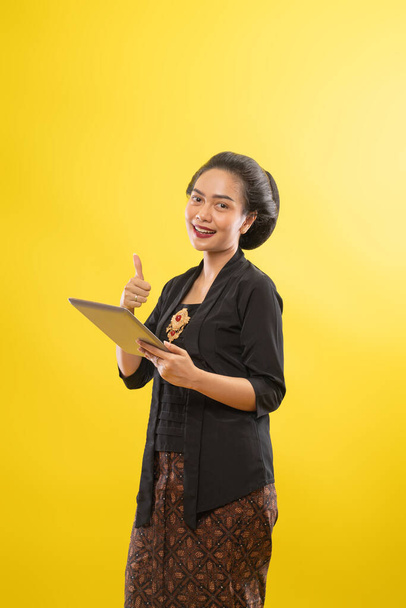 happy asian woman with kebaya using tablet computer - Fotografie, Obrázek