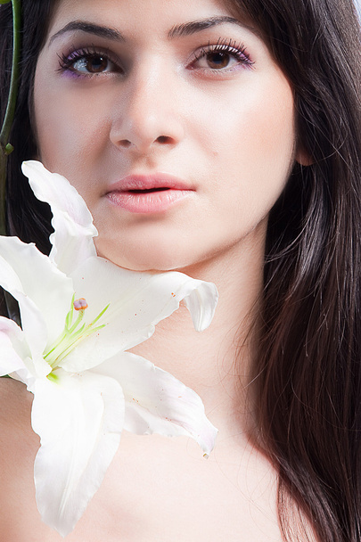 Beautiful woman with lily - Фото, изображение