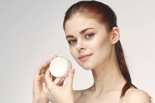 woman with jar of cream makeup face skin care close-up - Фото, зображення