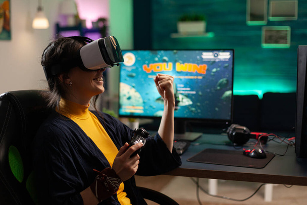 Woman using vr headset to play video games - Photo, Image