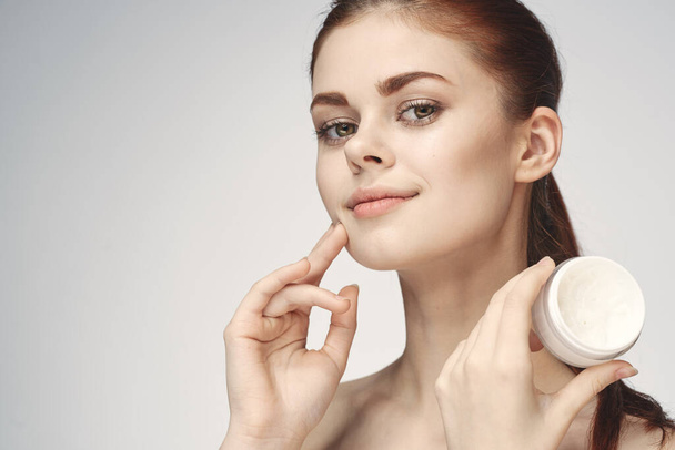 woman with jar of cream makeup face skin care close-up - Foto, imagen