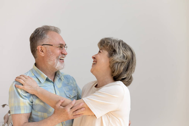Cheerful old married couple hugging, dancing, laughing - Foto, afbeelding
