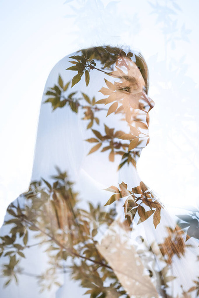 Multi exposure large portrait of a girl and leaves. - Foto, Imagen