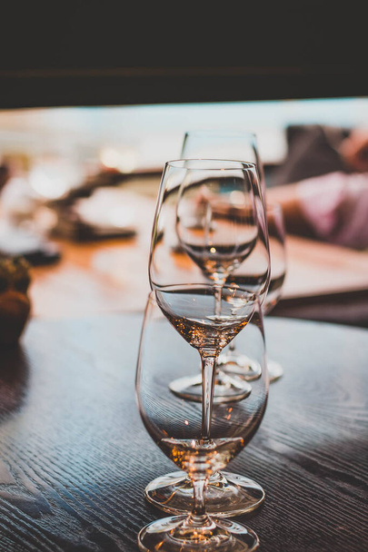 Glassware on a table setting in a high class restaurant - Fotoğraf, Görsel