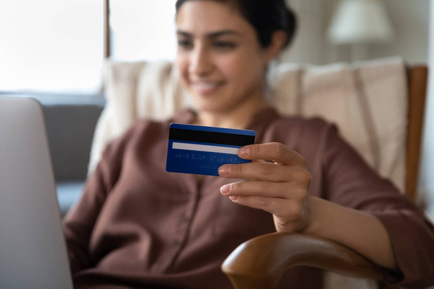 Focus on banking plastic credit card in in female hands. - Zdjęcie, obraz