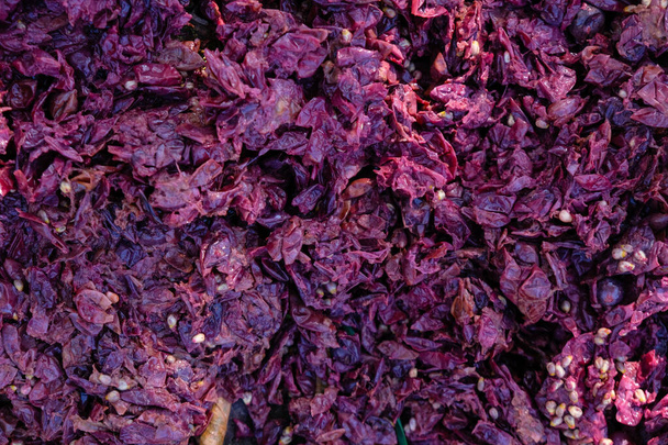 Grapes pomace background. Solid remains. Skins, pulp, and seeds. Wine-making process. - Photo, Image