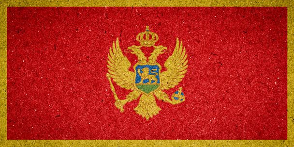 Montenegro vlag op papier achtergrond - Foto, afbeelding