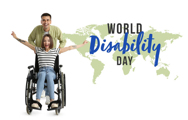 Щаслива молода жінка в інвалідному візку і її чоловік на білому фоні. Міжнародний день інвалідів - Фото, зображення