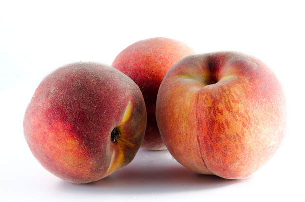 three ripe peaches isolated on white background - Foto, imagen