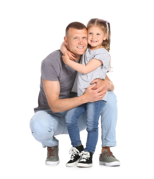 Little girl having fun with dad isolated on white - Foto, Bild