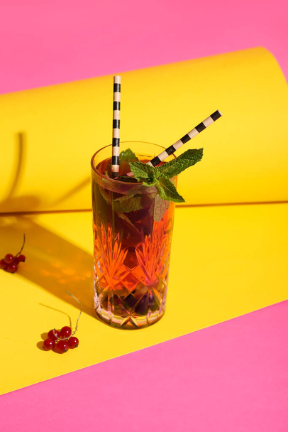 Glass of delicious cocktail with mint on color background - Photo, image