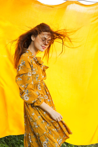 woman in dress posing nature yellow cloth fresh air - Фото, изображение