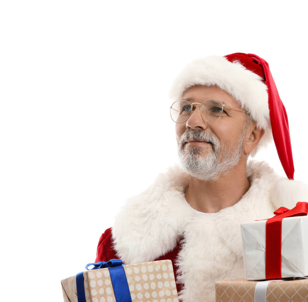 Portrait of Santa Claus with Christmas presents on white background - Photo, Image