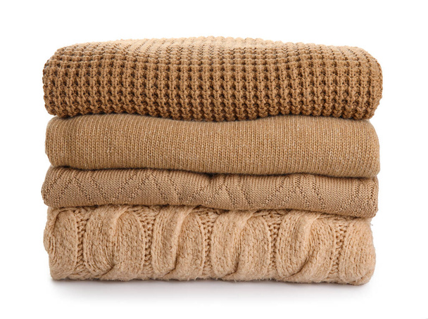 Stack of trendy sweaters on white background - Photo, Image
