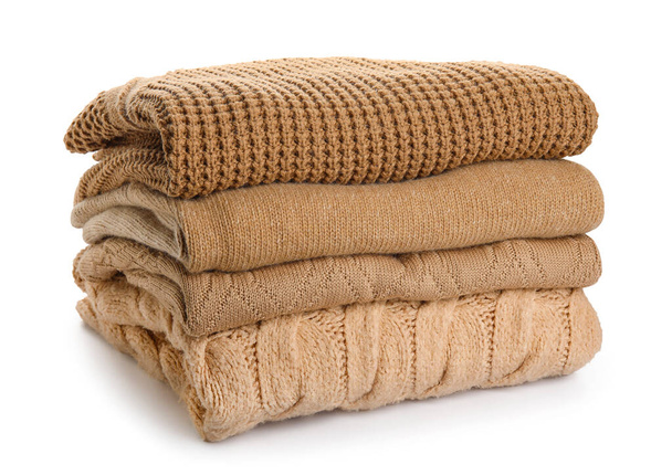 Stack of trendy sweaters on white background - Photo, Image