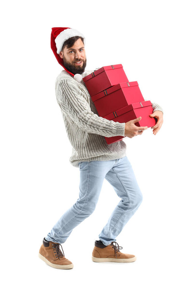 Walking man with Christmas gifts on white background - Foto, immagini
