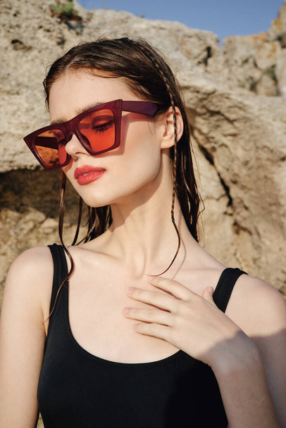 woman in a swimsuit sunglasses summer tan exotic travel - Fotografie, Obrázek