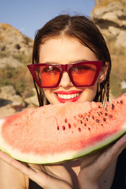 woman eating watermelon outdoors Sun summer close-up - Photo, Image