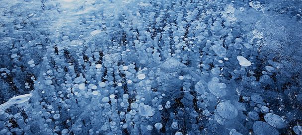 texture ice bubbles air baikal gas hydrogen sulfide nature winter background - 写真・画像
