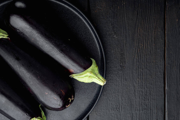 Fresh raw Purple Eggplant set, on black wooden table background, top view flat lay, with copy space for text - Φωτογραφία, εικόνα