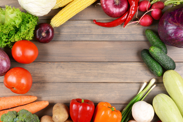 Fresh organic vegetables on wooden background - 写真・画像