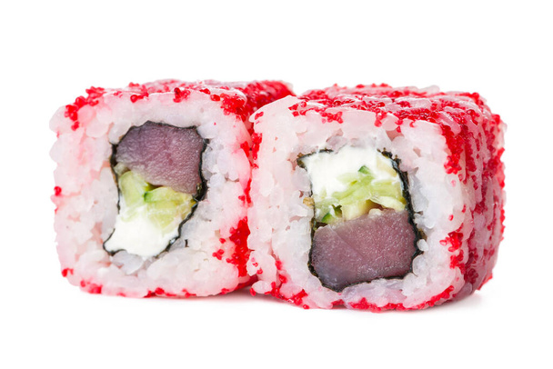 Side view of Two pieces Japanese sushi roll with red flying fish roe Tobiko on top. Tuna, cucumber, cream cheese in inside out roll isolated on white background. Copy space menu image - Photo, Image